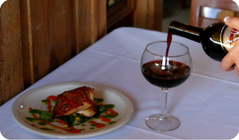 A view of the water and wine from inside of Four Winds Steakhouse.